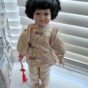 Elegant Cream Doll with Black Hair